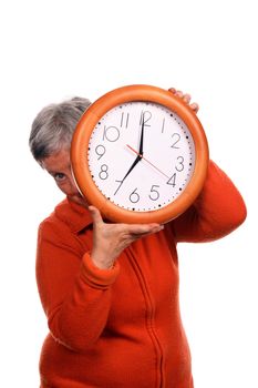 mature woman with clock over white background