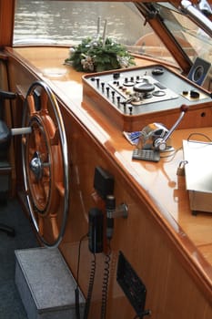 Nice wooden wheelhouse modern interior with steering wheel