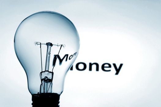 bulb and money text showing concept of financial success