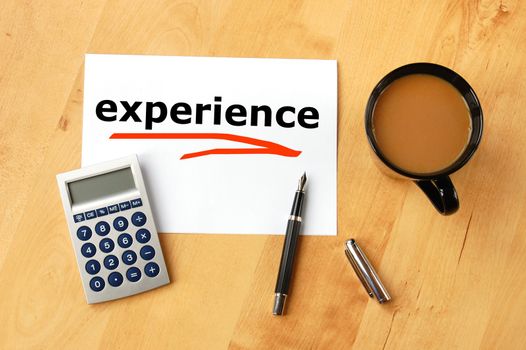 business experience concept with coffee pen and paper on desk in office