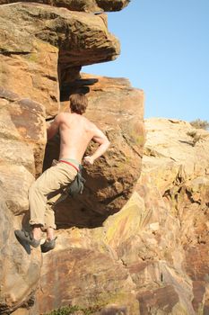 rock climber scalling a wall