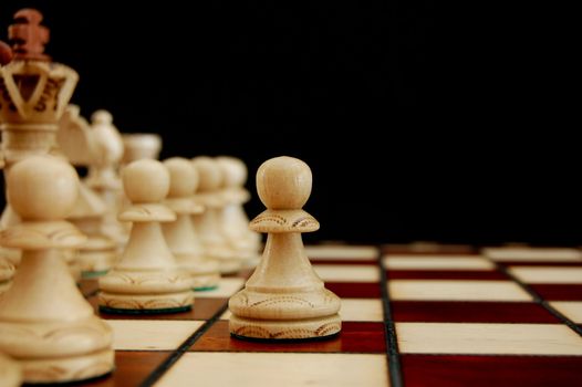 chess pieces showing concept of conflict power and success