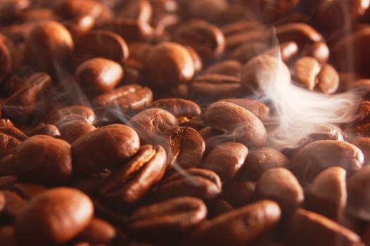 roasting coffee beans with smoke and steam