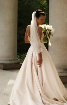 Beautiful bride with bouquet in park. Easy blur