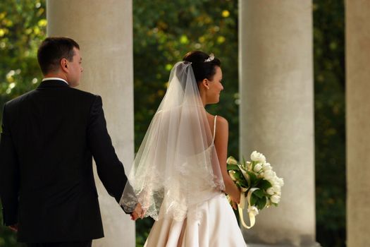 Newly-married couple in park