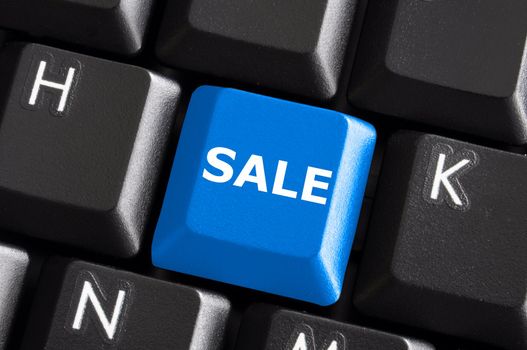 sale business or ecommerce concept with blue keyboard