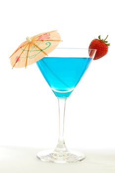 blue martini cocktail with strawberry and umbrella