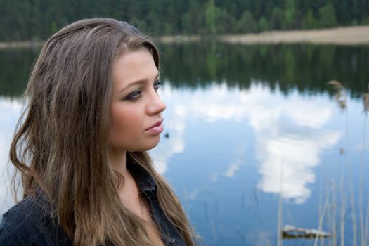  Portrait of young sexual girl on lake background