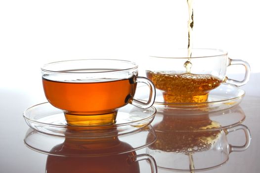 cup of tea on white with reflection