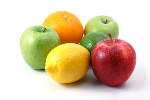 fruits like apple , lemon , citron orange and lime isolated on a white background