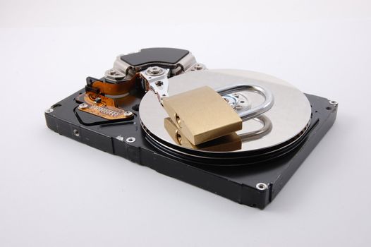 computer hard disk drive and a padlock isolated on white background