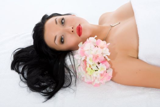 Attractive woman getting spa treatment on white