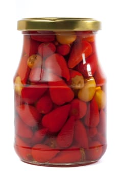 Jar filled with small peppers isolated on white background