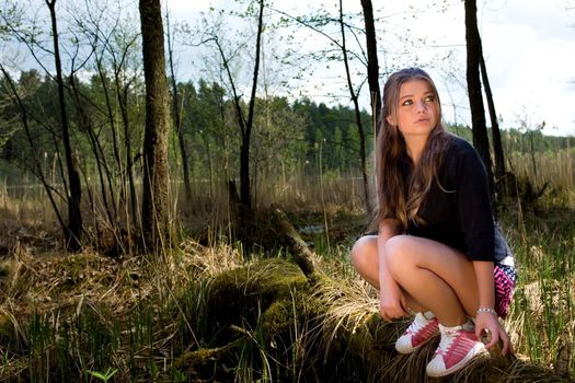 Portrait of young girl on forest background
