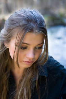 Portrait of young girl on forest background