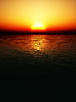 A seascape with a sunset or sunrise.