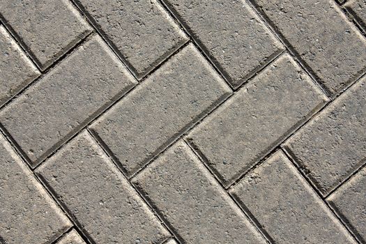 close up of a brick uniformed patterned pavement 