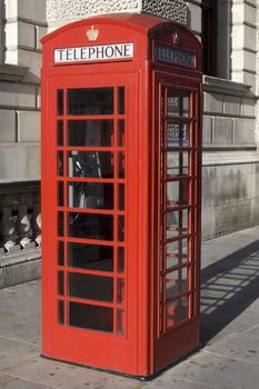 British Red phone box with the word telephone across the top