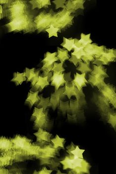 a pattern of bokeh star shapes created at a fireworks display