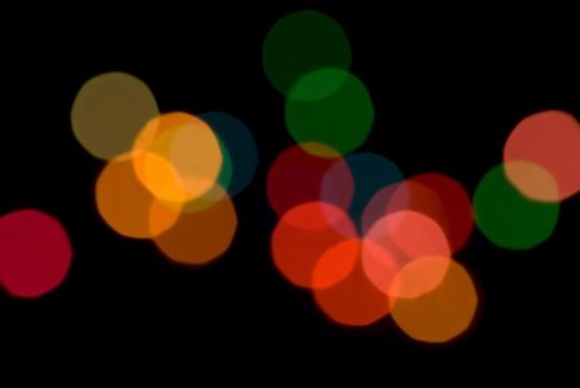 a colourful pattern of out of focus bokeh circles