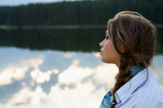 Portrait of young sexual girl on lake background
