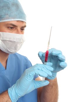 Doctor, surgeon, hematologist or other medical specialist checking or preparing a syringe needle.  Focus to hands and syringe.