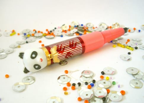 Toy pen and shining beads