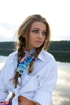 Portrait of young sexual girl on lake background