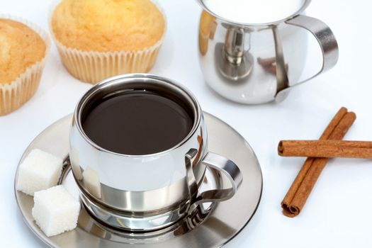 Cup of black coffee with muffin, milk and cinnamon, coffee series
