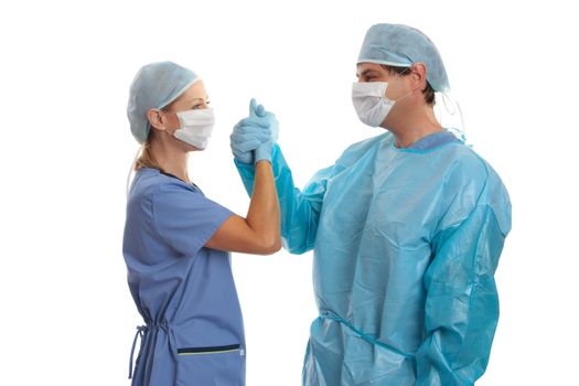 Doctors and surgeons congratulate one another on a surgery or other medical procedure  success, well done.