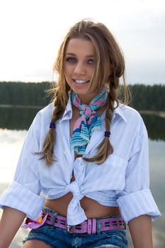 Portrait of young sexual girl on lake background