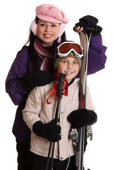 Two skiers wearing winter  ski gear ready for the ski slopes.