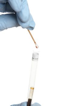 A swab is tested for blood.   After placing the tip in the tube  the bottom vial is pressed and allowed to mix with the swab tip.  A second vial in the lip is then broken, the resulting colour should be a blue green if there is presence of blood (lmg blood test method)