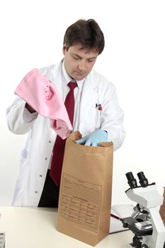 Fbi or crime scene detective dealing with evidence.