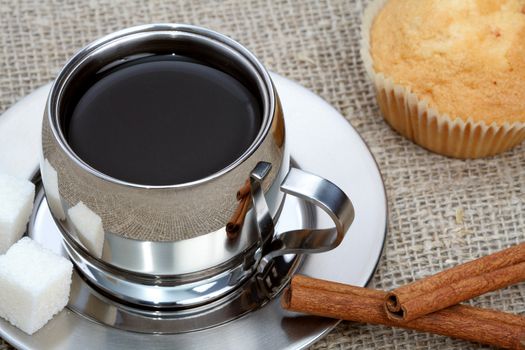 Cup of black coffee with muffin and cinnamon, coffee series
