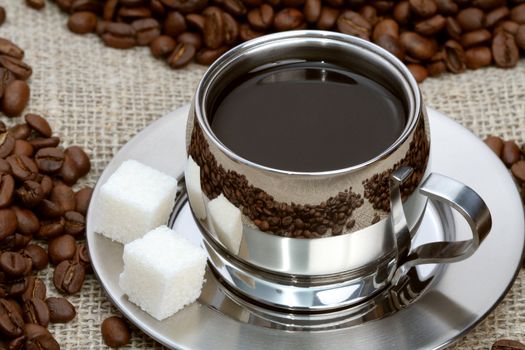Cup of coffee with lump sugar and beans, coffee series
