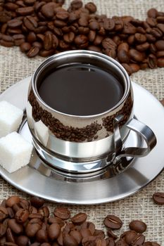 Cup of coffee with lump sugar and beans, coffee series