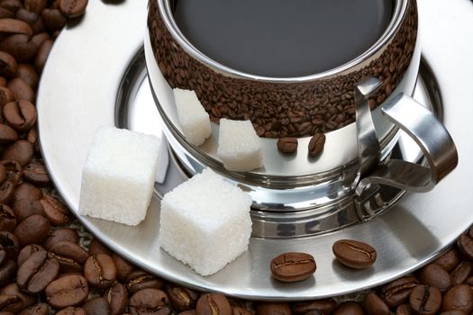 Cup of coffee with lump sugar and beans, coffee series