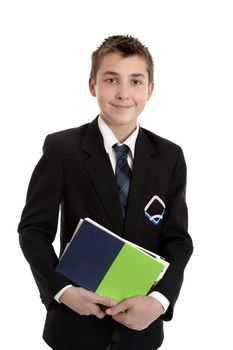 A secondary school student wearing his school uniform holding a bunch of text books.