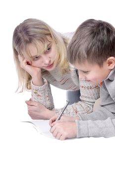 Mother with her son drawing in copy-book together
