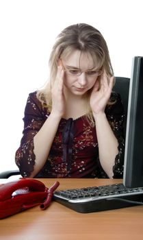 secretary corrects spectacles and sits with red telephone and computer at the table