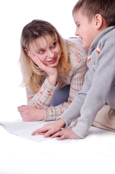 Mother with her son drawing in copy-book together