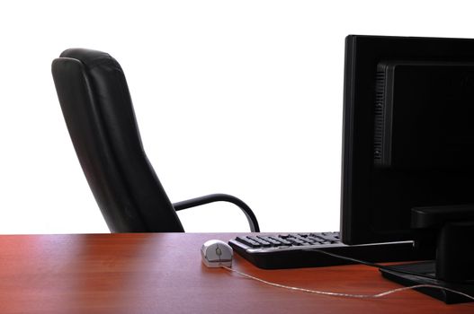 Empty Office Chair And Desk With Computer Keyboard