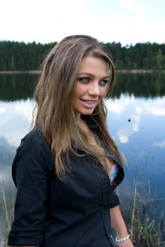  Portrait of young sexual girl on lake background