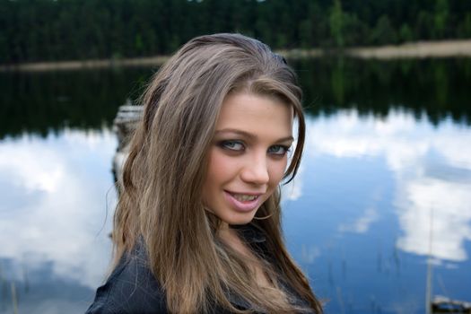 Portrait of young sexual girl on lake background