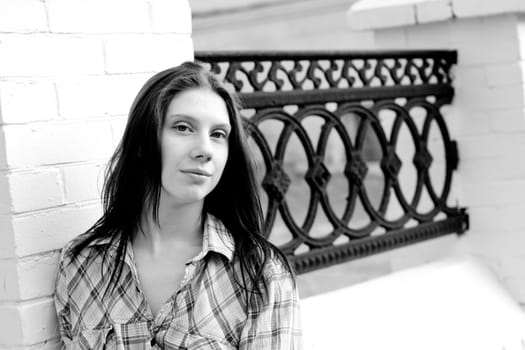 Girl near old fence 
