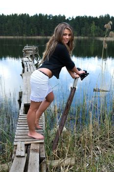  Portrait of young sexual girl on lake background
