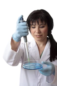 Female scientific researcher at work using laboratory equipment