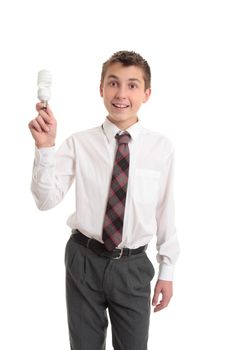 A school boy holding an  energy efficient eco friendly light bulb