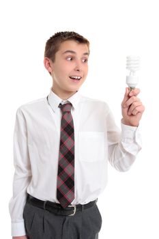 Student with a light bulb idea or inspiration.   He is holding an eco friendly fluorescent light bulb